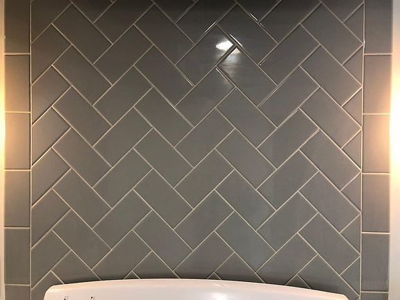 Custom tile installed behind range.