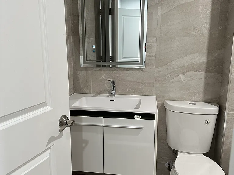 basement bathroom with a deep bathtub