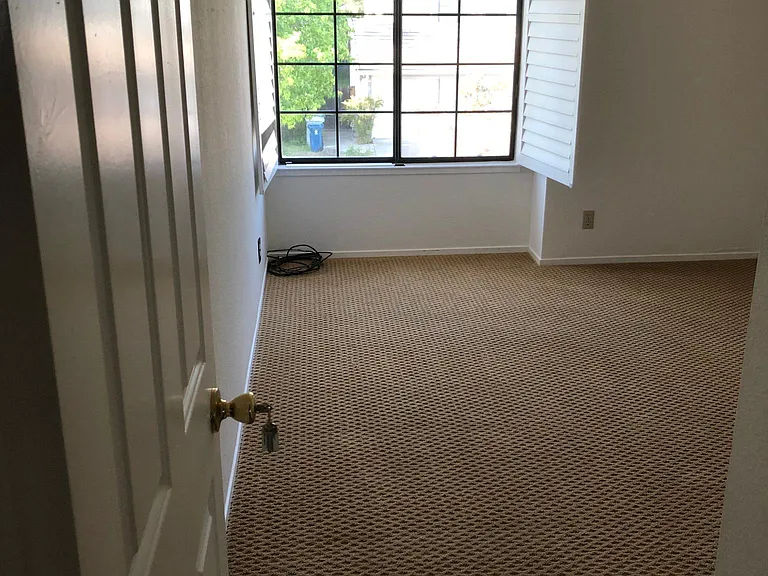 bedroom 2 facing street with recessed lights