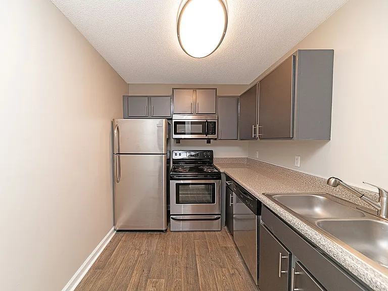 Kitchen with modern cabinetry & stainless appliance package