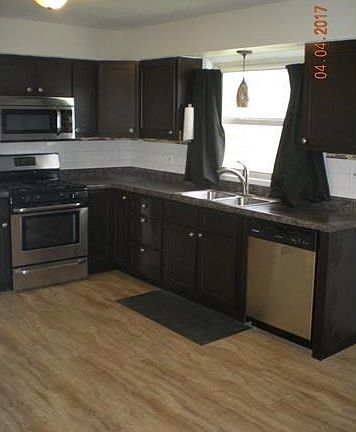Kitchen with updated appliances included with the sale