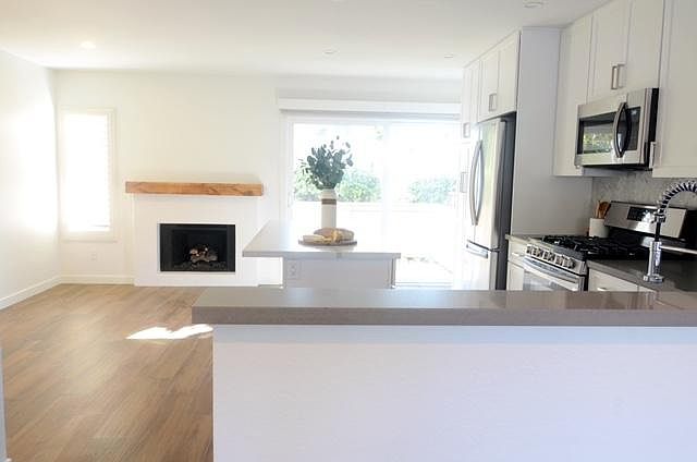 Kitchen from living room looking out to patio.