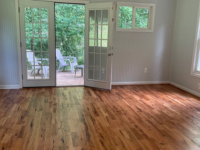 Spacious bedroom leads to lovely deck.