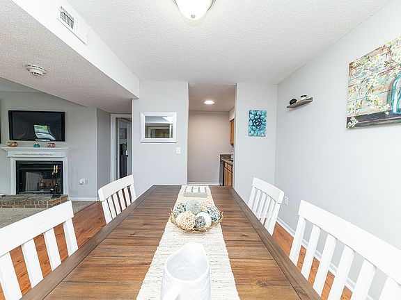 Dining area with hardwood-style flooring