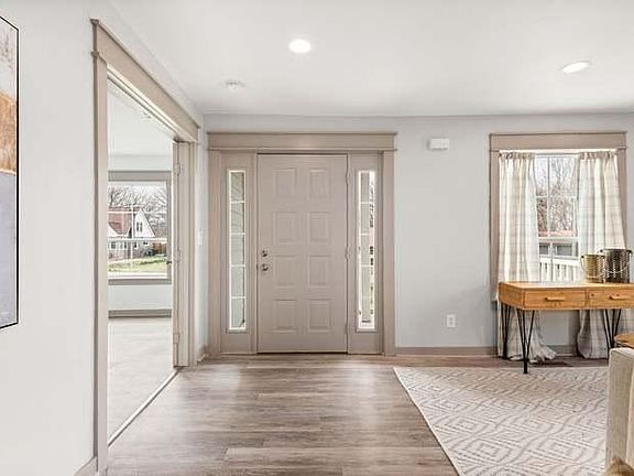 Front door. Living room to the right. Front bedroom to the left.