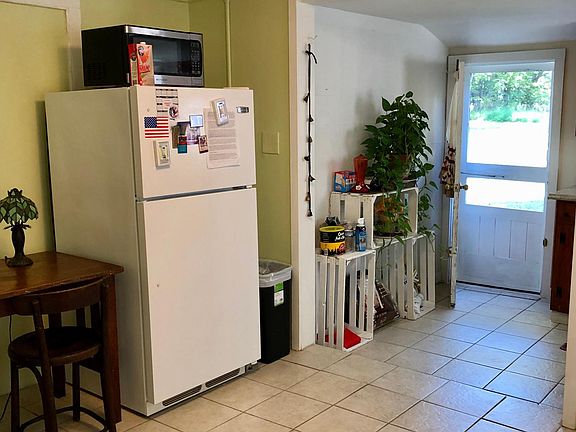 Dining area with closet and two windows with lots of light