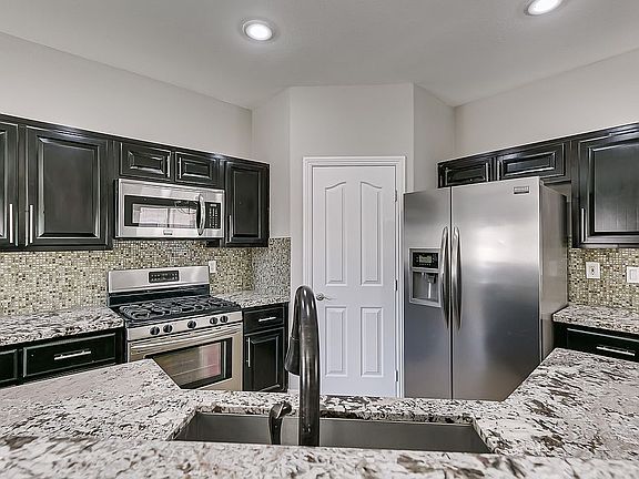 5th image of 8755 Traveling Breeze Ave Unit 103
