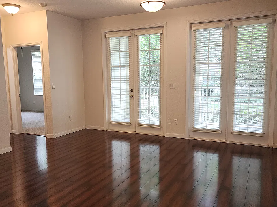 NW side French door and window. 2ed bedroom on left side of photo.