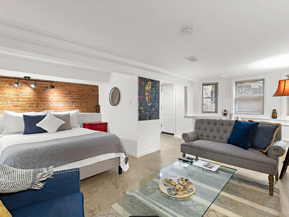 Bed opens up to seating/coffee table and a TV