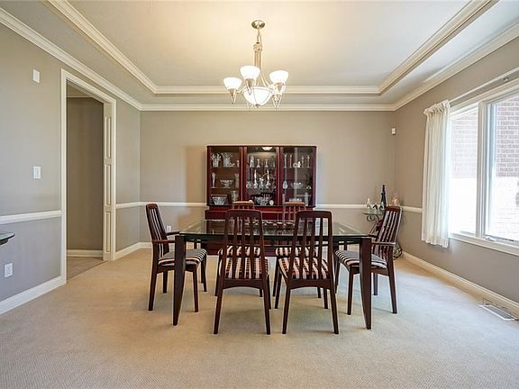 Formal Dining w/ Tray Ceiling & Chandelier!