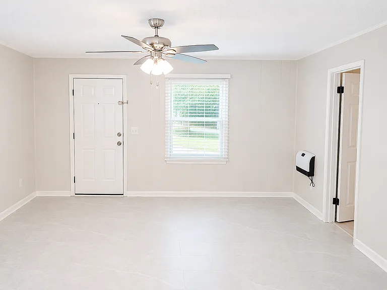 Cozy step-down den or TV room, ideal for movie nights, game days, or relaxing at home.
