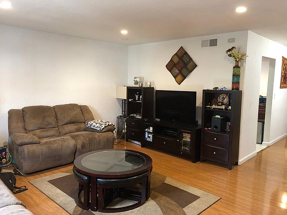 Living room with window facing hills view
