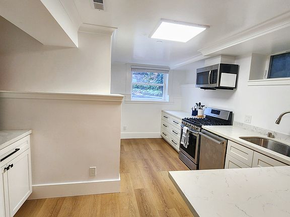 Kitchen: Coffee nook to the left and peninsular counter - dining to the right