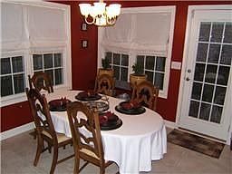 Dinning room with windows finished off by casing