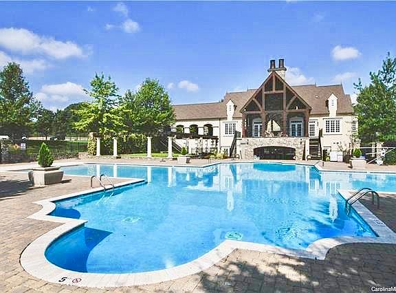 Clubhouse with large pool and tennis courts included with rental.