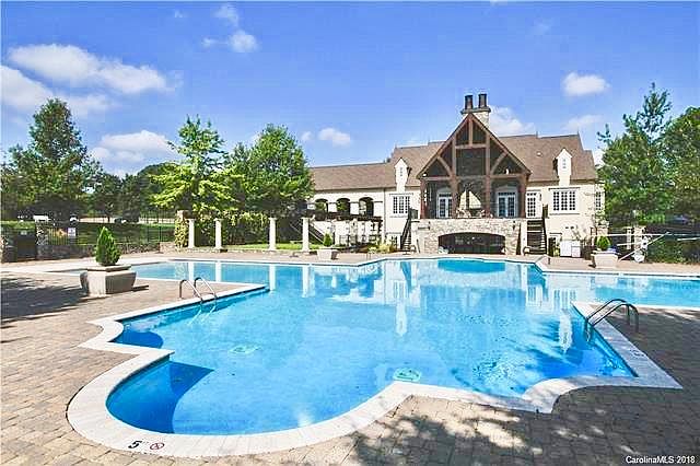 Clubhouse with large pool and tennis courts included with rental.