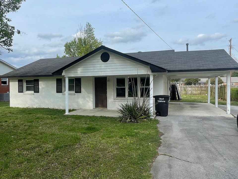 Front of house with plenty of parking.