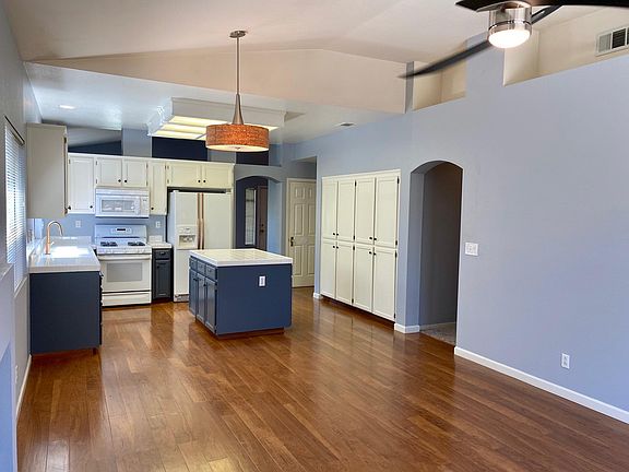 Newly painted living room/kitchen area.