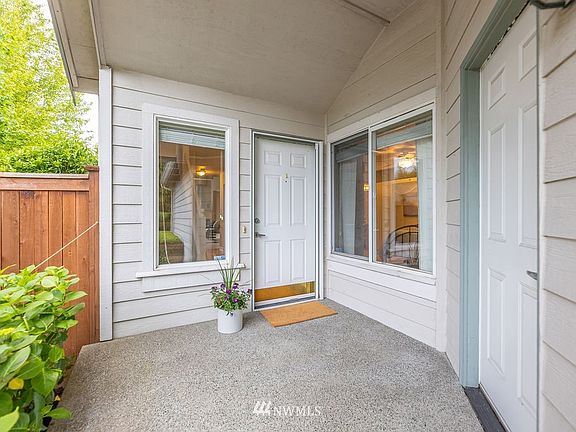 Large front patio. The garage door leads to your own private patio. 