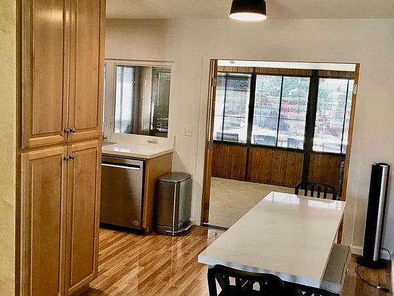 Entering the front door leads to the family room, kitchen and newly painted interior of the house.