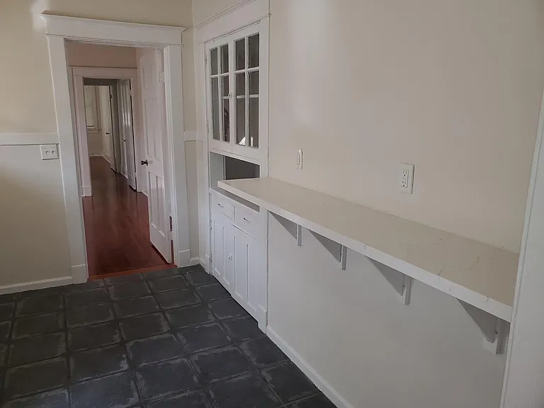 Kitchen breakfast bar and original built-in cabinet
