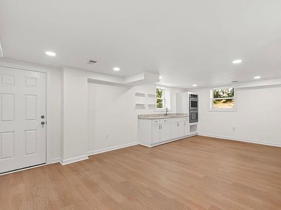 Kitchen & dinning space. Door leads to private entrance & exit.