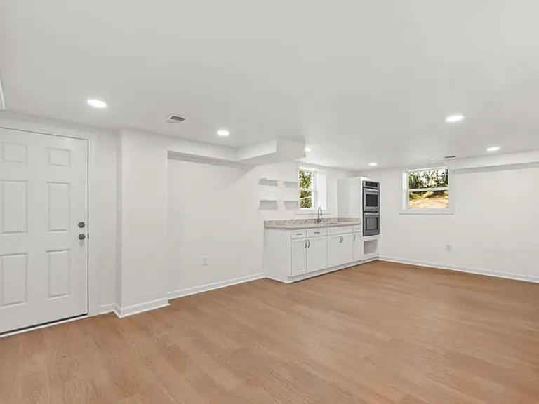 Kitchen & dinning space. Door leads to private entrance & exit.