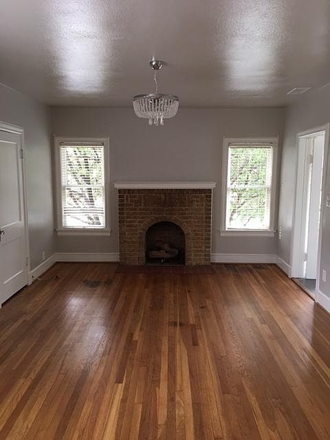 Spacious living room with hardwoods