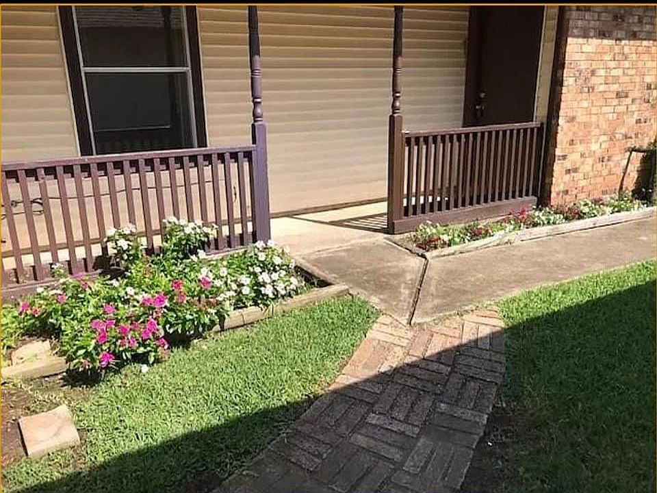 Washer and dryer hook up in garage connected by enclosed front porch