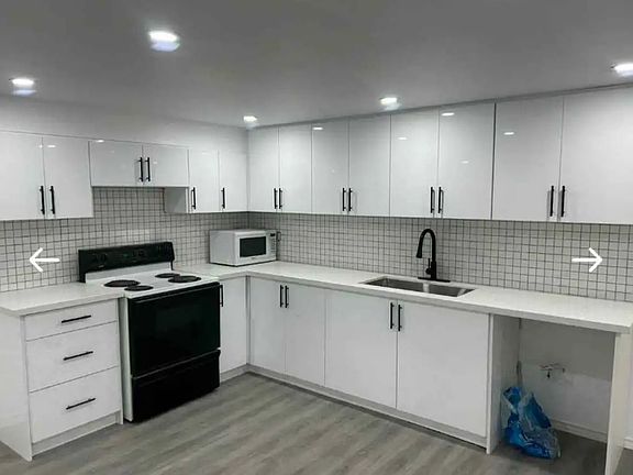 Full sized kitchen with stove and fridge