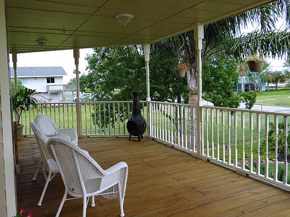 ENJOY THE SUMMER BREEZE ON YOUR OVERSIZED  WRAP AROUND FRONT PORCH
