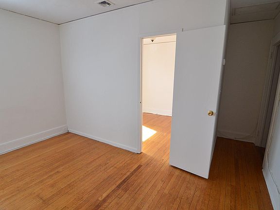 This is the Main Living area looking towards the Bedroom. The Bathroom is behind you here. To the far right is the entry hall to the apartment, which does have some additional closet space.