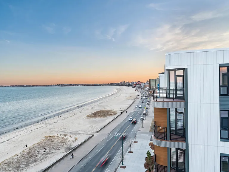 Sunrise views over Revere Beach and direct access to the shoreline just outside your door.
