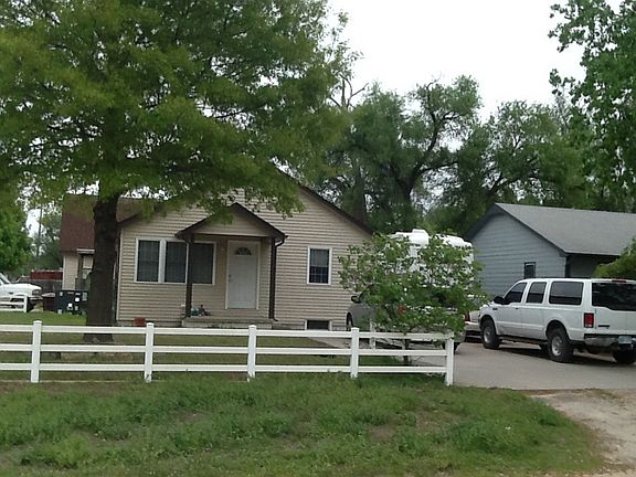 Front view with large oak