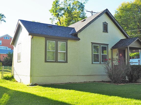 Front facade and view of the south side of home