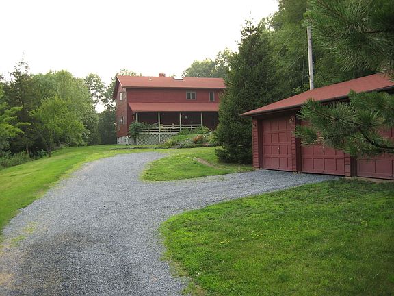 long driveway wit hdetached garages