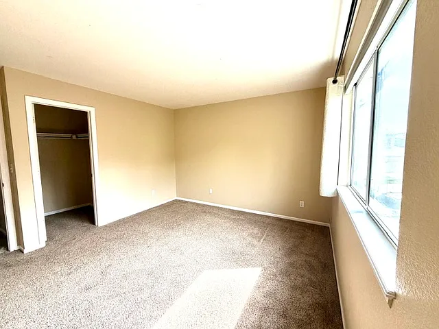 Guest bedroom #1 with a walk-in closet.