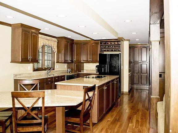 Plenty of counter work space and storage with granite countertops and gorgeous custom cabinets