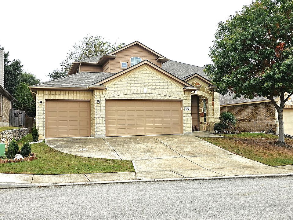 Front of home, 3 car garage.