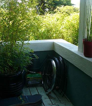 Cozy outdoor space can accomodate a "bar" or cafe table.