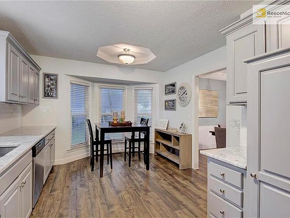 Breakfast nook area with wall of windows allows for plenty of sunshine!