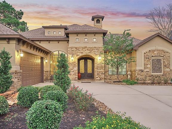 Instant curb appeal with intentional landscaping and double doors for a dramatic entrance.