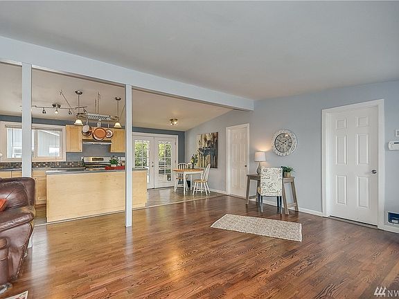 Fabulous open concept living and freshly refinished red oak floors in the living room and throughout the hall.