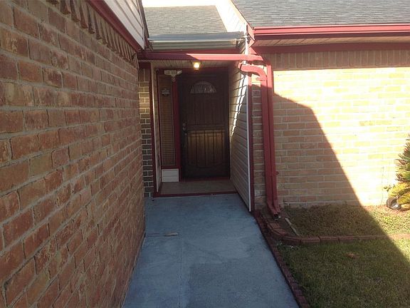 The home has a covered porch to provide shade and helps on rainy days.