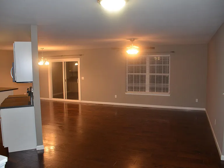 view from front door showing living room, kitchen and dining room