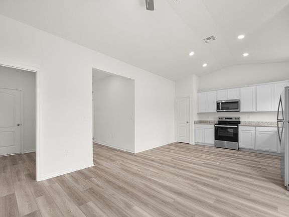 Spacious family room and adjoining kitchen