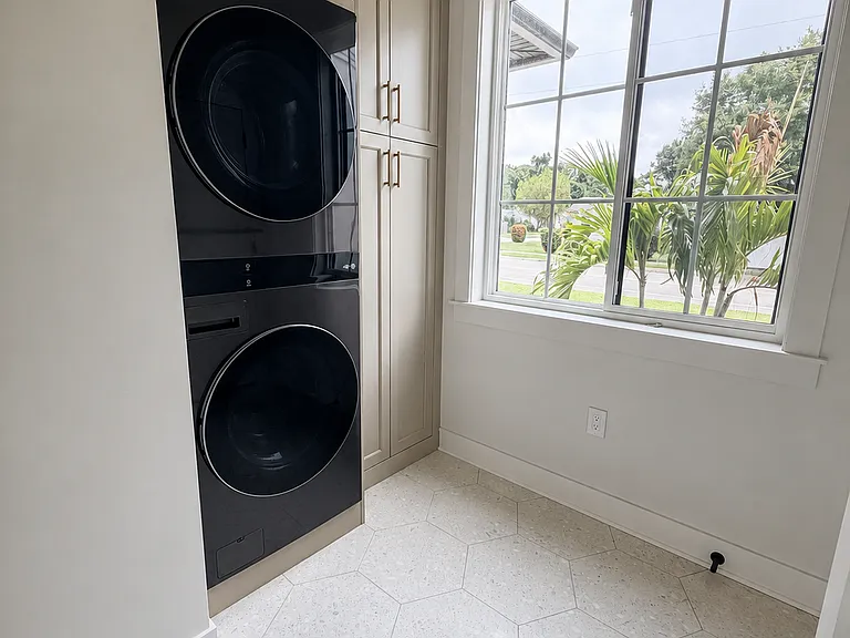 Laundry Room with custom built-in cabinetry.