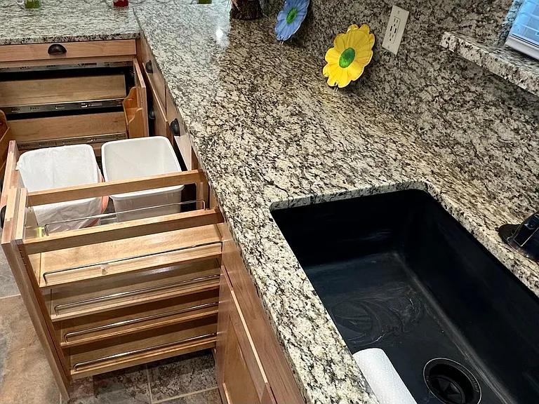 Spice rack, double trashcans.