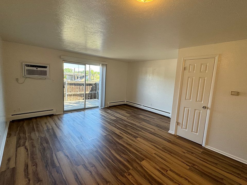 Living room with new A/C and new LVP.