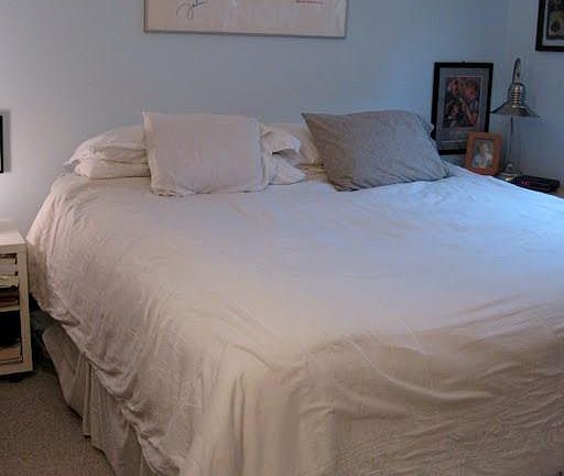 bedroom shown with queen-size bed